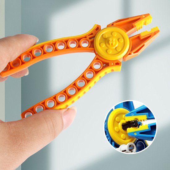 Hand houdt een oranje tang vast met gele accenten, met een ingekaderde detailweergave.