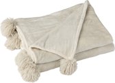 Beige plaid met pompons aan één zijde, gevouwen.