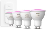 Bol.com Philips Hue GU10 spot bundel 4 stuks - wit en gekleurd licht - 57W - Bluetooth - 1 Dimmer Switch - Dimbaar aanbieding