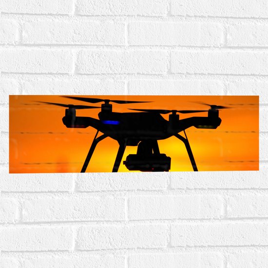 Muursticker - Silhouette van Drone bij Zonsondergang - 60x20 cm Foto op Muursticker