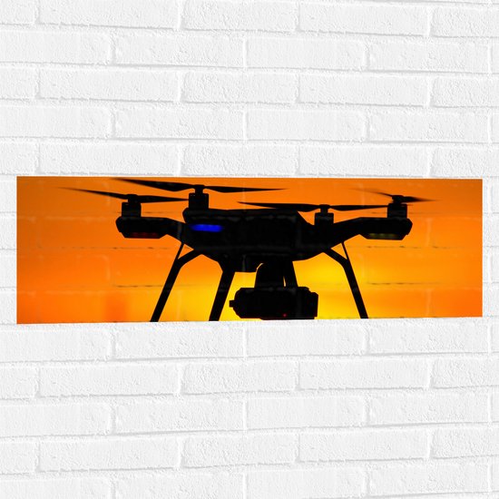 Muursticker - Silhouette van Drone bij Zonsondergang - 90x30 cm Foto op Muursticker