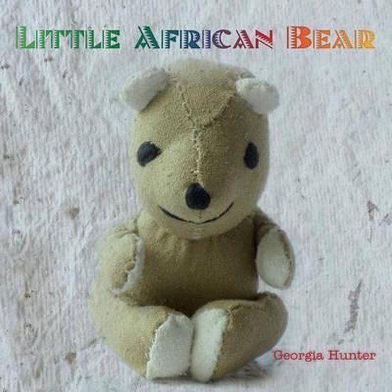 Boekcover van 'Little African Bear' met een zacht bruine teddybeer met zwarte ogen en neus, en witte oortjes en pootjes.