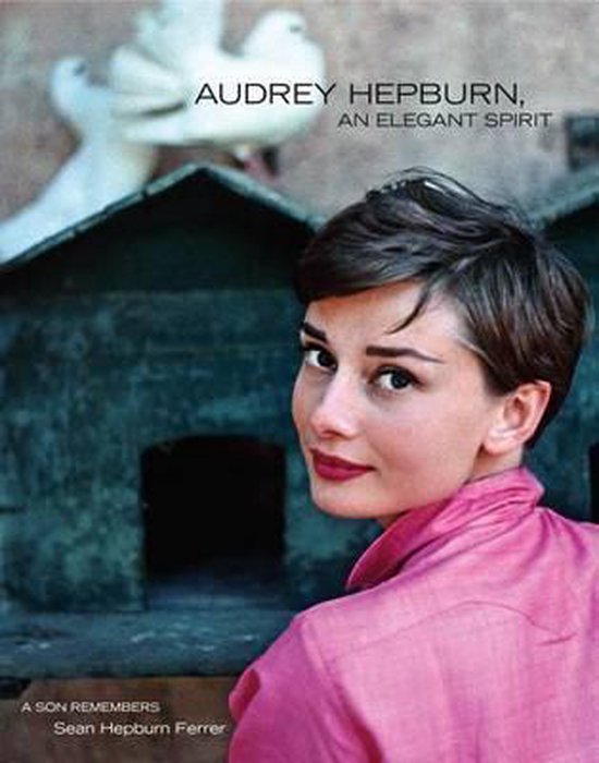 Audrey Hepburn met roze blouse, met tekst 'Audrey Hepburn, An Elegant Spirit'.
