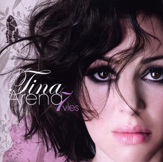 Tina Arena 7 Vies albumhoes met vlinder en bloemenpatroon.