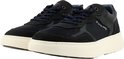 Paar blauwe G-Star Raw sneakers in een schuine opstelling, crèmekleurige zolen.