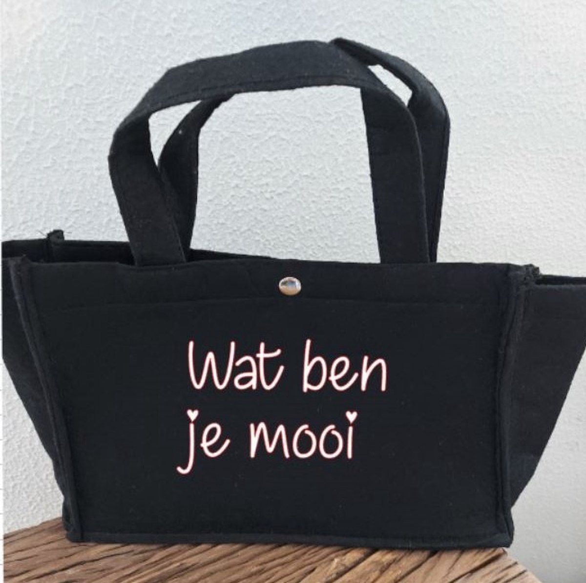 Bedrukte vilt tas met tekst: Wat ben je mooi