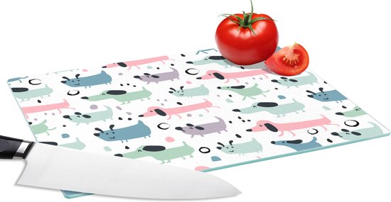 Planche à découper en verre avec un motif blanc de teckels joyeux et cartoon, aux couleurs pastel rose, menthe et bleu.