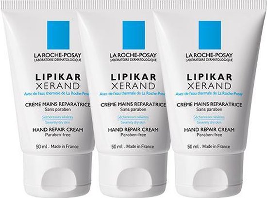 Drie witte tubes La Roche-Posay Lipikar Xerand handcrème, 50 ml, met blauw logo.
