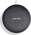 Donkergrijze Google Nest Mini met vier witte led-lampjes aan de bovenkant.