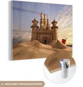 MuchoWow® Glasschilderij 80x60 cm - Schilderij acrylglas - Zandkasteel op het strand - Foto op glas - Schilderijen