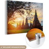 MuchoWow® Glasschilderij 60x40 cm - Schilderij acrylglas - De zon schijnt tussen de tempels door in Ayutthaya - Foto op glas - Schilderijen