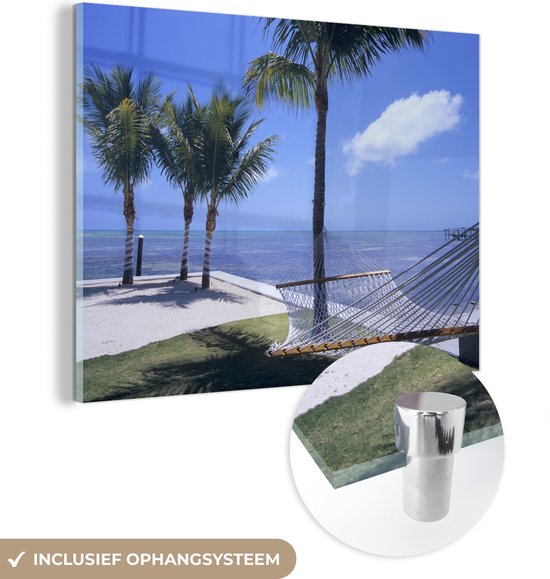MuchoWow® Glasschilderij 80x60 cm - Schilderij acrylglas - Zee - Hangmat - Palmboom - Foto op glas - Schilderijen