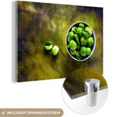 MuchoWow® Glasschilderij - Spruitkool op een groen geschilderde achtergrond - 90x60 cm - Acrylglas Schilderijen - Foto op Glas