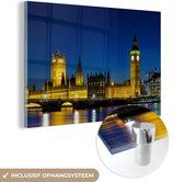 MuchoWow® Glasschilderij 90x60 cm - Schilderij acrylglas - De Big Ben in de avond verlicht in Londen - Foto op glas - Schilderijen