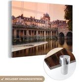MuchoWow® Glasschilderij 120x80 cm - Schilderij acrylglas - Uitzicht op Bath vanaf het water tijdens de zonsondergang - Foto op glas - Schilderijen