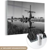 MuchoWow® Glasschilderij 150x100 cm - Schilderij acrylglas - Molen - Lente - Nederland - Zwart - Wit - Foto op glas - Schilderijen