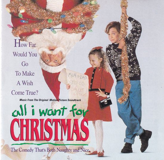 De hoes van de film 'All I Want for Christmas' met een vallende kerstman, een jongen en een meisje met een lijst waarop 'Mom+Dad Stereo Ballet Lessons' staat.