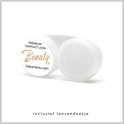 Een witte lenzenhouder van "Beauty" met de tekst "premium contact lens" en "kleurlens.com".