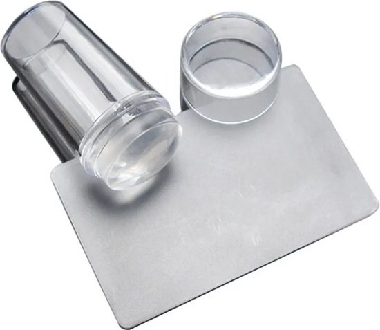 Transparante nagelstempel met schraper, de dop is naast de stempel geplaatst.