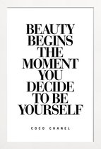 JUNIQE - Poster met houten lijst Beauty Begins - Coco Chanel quote