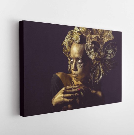 Halloween golden woman or girl holding painted gold pumpkin has pretty face with makeup and body art metallized color with decorative flowers on head on black background. - Modern Art Canvas - Horizontal - 1165611829 - 40*30 Horizontal