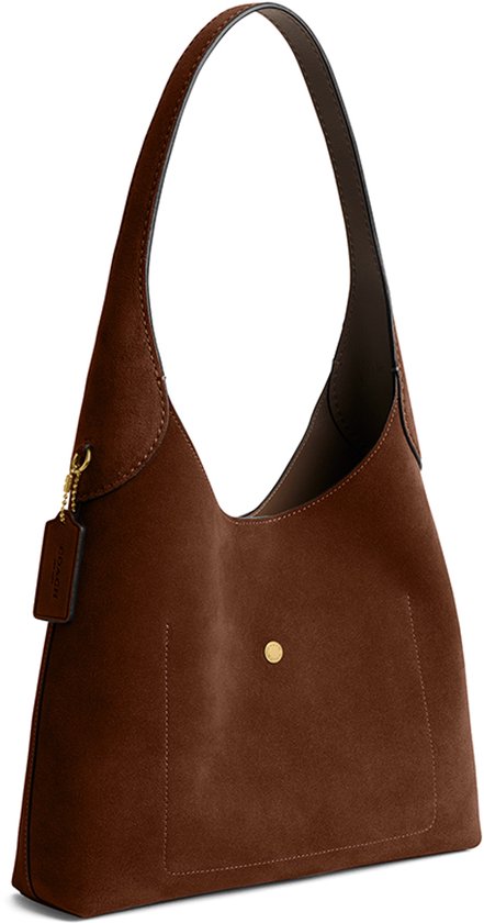 Sac bandoulière marron en daim Coach avec une fermeture à bouton-pression sur le devant.
