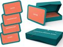 Kaarten van Het Kernwaarden Spel met woorden zoals "LIEFDE", "VRIENDSCHAP", "LEVEN" en de speldoos.