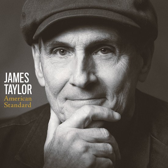 Albumcover van James Taylor's American Standard met een sepia foto van hem met een pet en een hand op zijn kin.