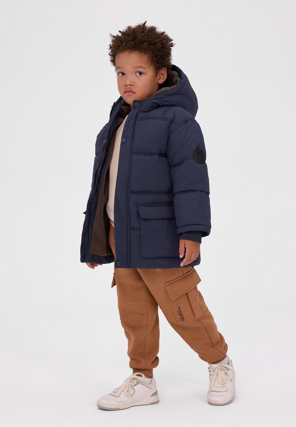 Minoti winterjas jongens – teddyvoering – drukknoopstrook – marineblauw
