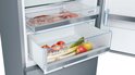 VitaFresh-lades met voedsel, waaronder vlees, kip, wortelen, appels en prei.