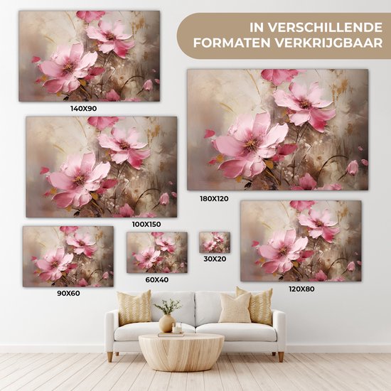 Canvas met roze bloemen in verschillende formaten, naast een bank.