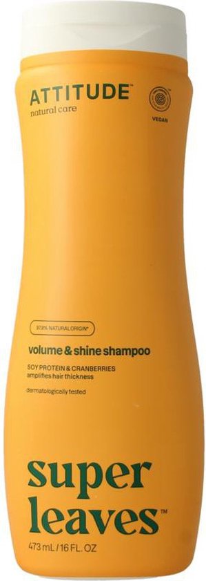 Oranje fles met witte dop, logo "Attitude" en tekst "volume & shine shampoo".