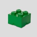 Groene LEGO opbergdoos met vier noppen op een grijze achtergrond.