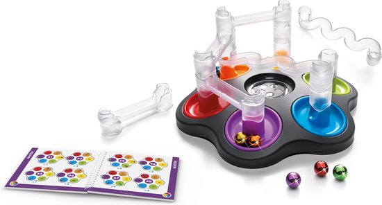 Dropzone spel met opengewerkte constructie, rode, paarse, blauwe, groene en gele bakjes, en een uitdagingsboekje.