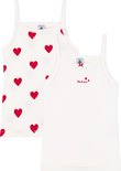 Twee witte topjes, één met rode hartjesprint en 'Petit Bateau' opschrift, de ander effen met strikje.