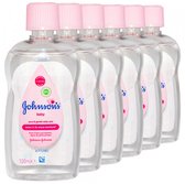Zes flessen Johnson's baby olie met roze dop. Elke fles bevat 100 ml pure & gentle daily care.