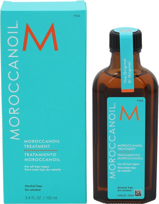 Amberkleurige fles met blauw label "MOROCCANOIL TREATMENT" en doos. Inclusief pompdispenser.