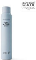 Lichtblauwe Keune 'Get A Grip' spray met 'Marie Claire Hair Awards 2024' logo.