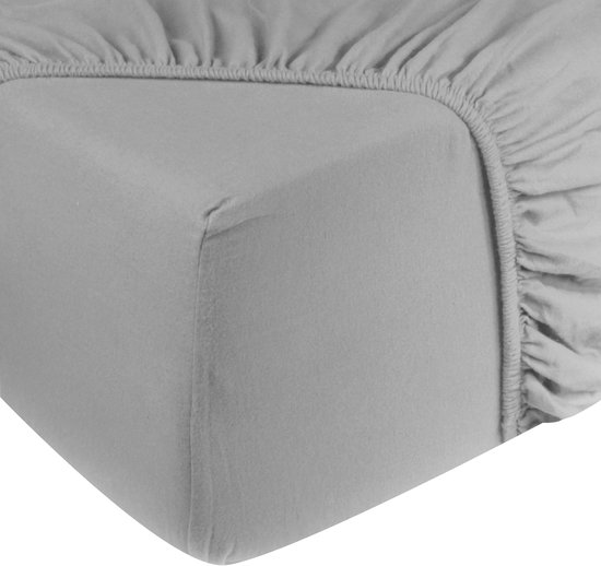 Gros plan d'un drap-housse gris clair avec un bord élastique.