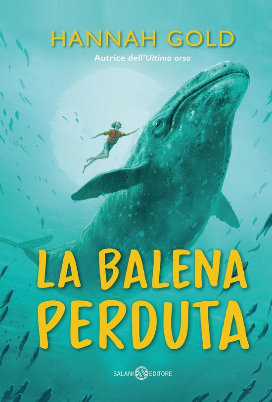 Couverture du livre 'La Balena Perduta' montrant une fille nageant à côté d'une grande baleine dans l'eau bleue, entourée de poissons. 'HANNAH GOLD' et 'LA BALENA PERDUTA' sont écrits en lettres jaunes.