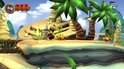 Donkey Kong saute sur une plage avec des crabes, un bateau pirate et des palmiers.