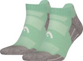 Groene sportsokken met grijze tenen en hiel. Logo van HEAD op de zijkant.