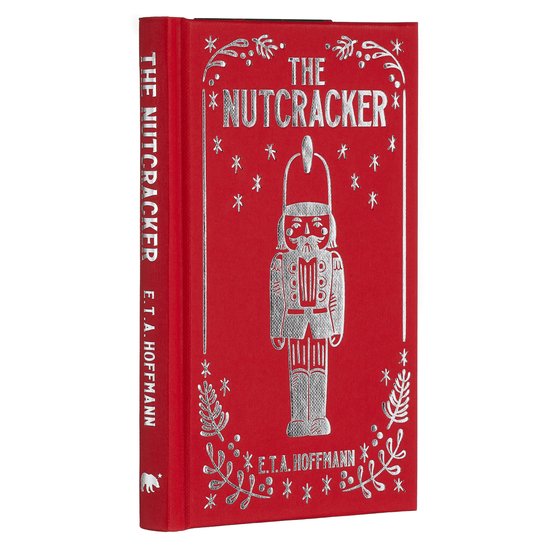 Rode 'The Nutcracker'-boek met zilveren opdruk van een notenkraker en versieringen. "THE NUTCRACKER E.T.A. HOFFMANN".