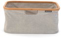 Grijze Brabantia wasmand met bamboe frame, op witte ondergrond.