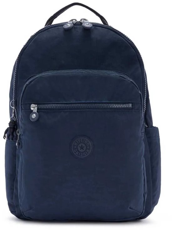 Sac à dos Kipling bleu foncé avec porte-clés singe gris, poche avant zippée et poches latérales.