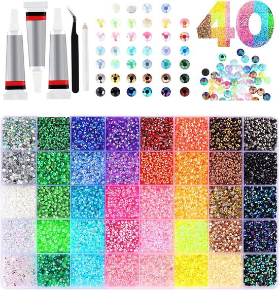 Een assortiment van 40 kleuren rhinestones, lijm en pincet.