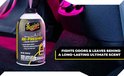Meguiar's Whole Car Air Re-Fresher, 2 oz., in een auto-interieur.
