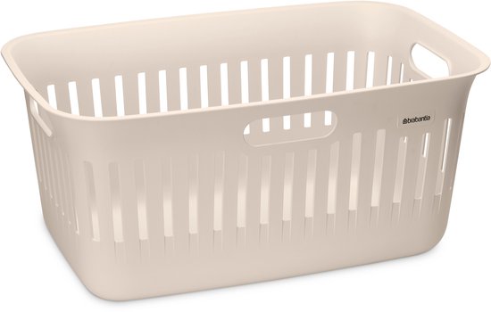 Crème wasmand met handgrepen en ventilatiegaten, op een witte achtergrond.