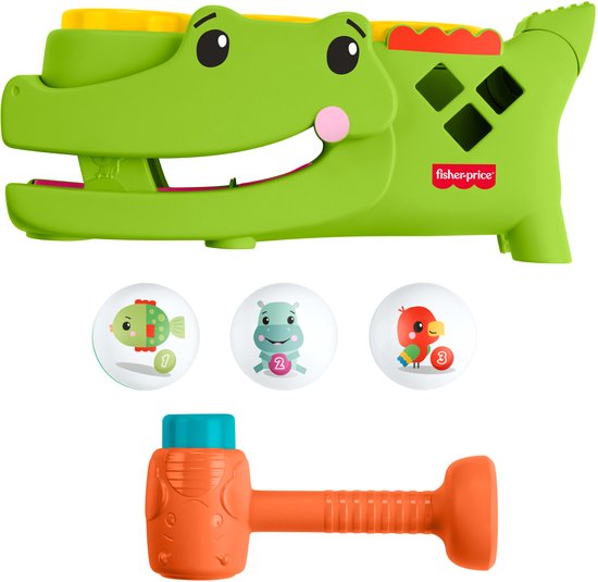 Groen krokodillenspeeltje met drie genummerde ballen en een hamer.