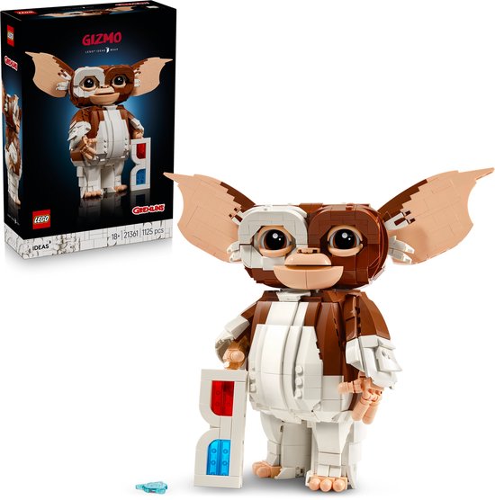 De LEGO Ideas Gizmo, gemaakt van bruine en witte blokjes, houdt een 3D-bril vast. De verpakking toont het LEGO logo en de titel 'Gizmo'.